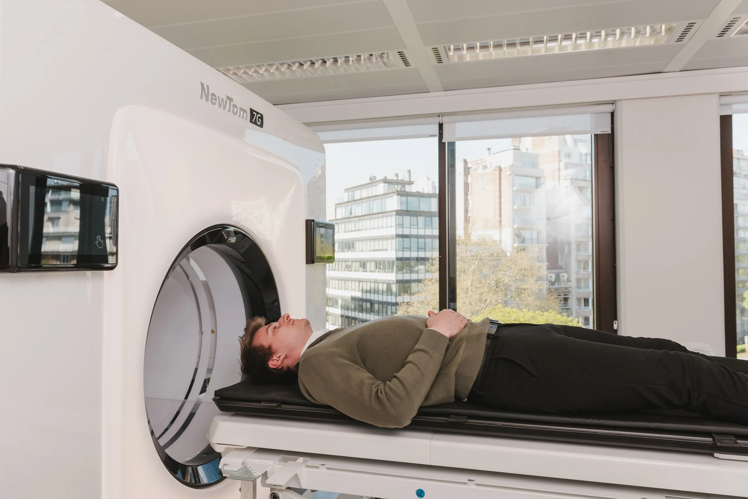 Patient on the table of the cone beam CT scanner