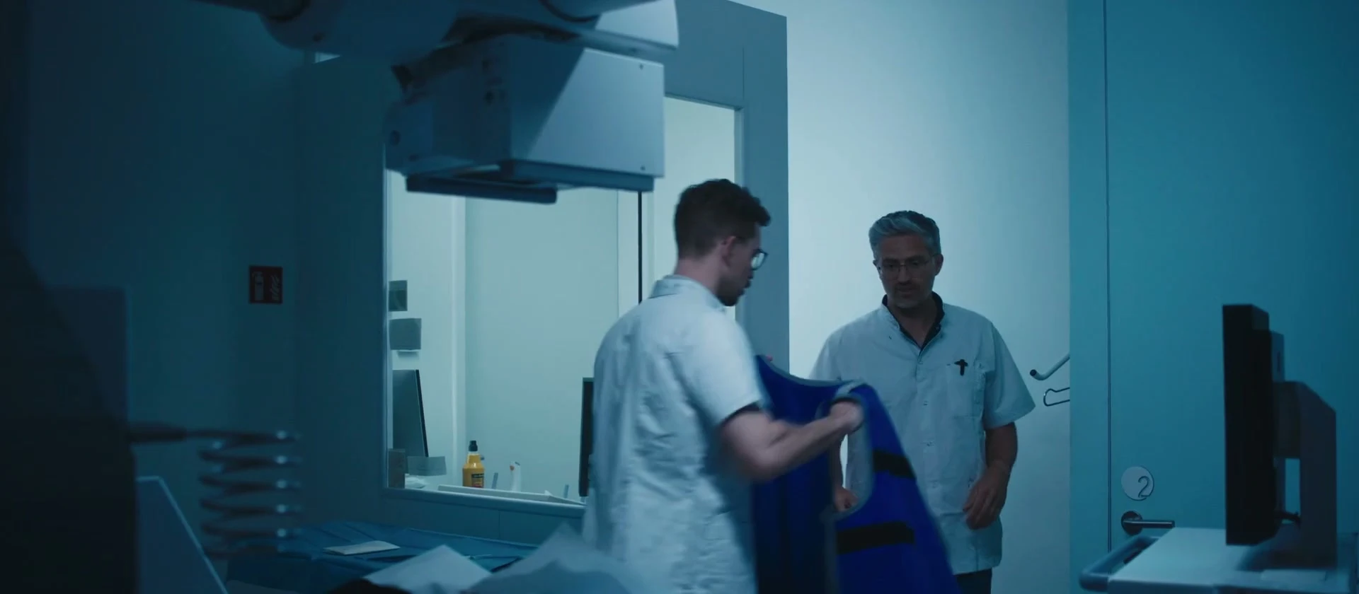 Radiology team preparing a patient for imaging